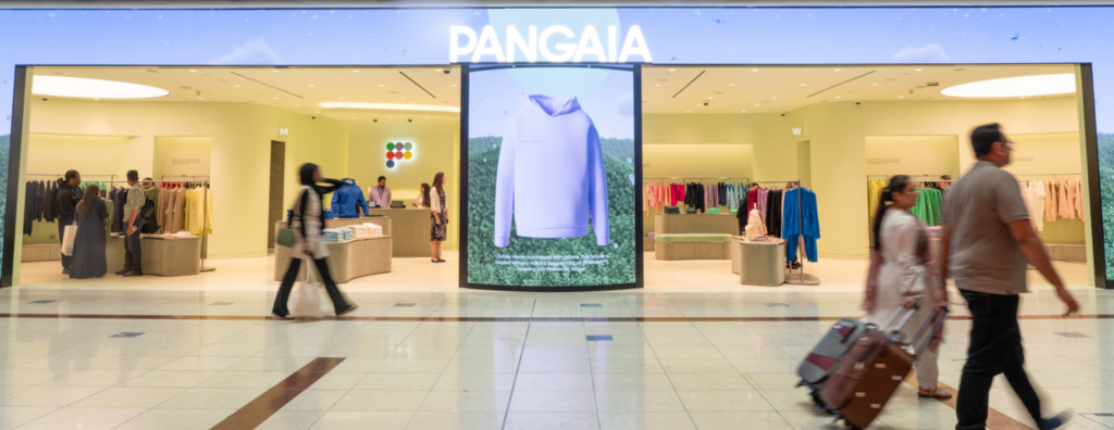 The Pangaia store front with people walking in front of it