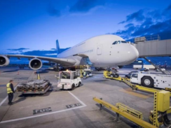 An image of a plane waiting on the tarmac