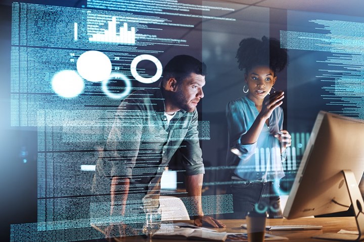 Two people looking at a computer screen