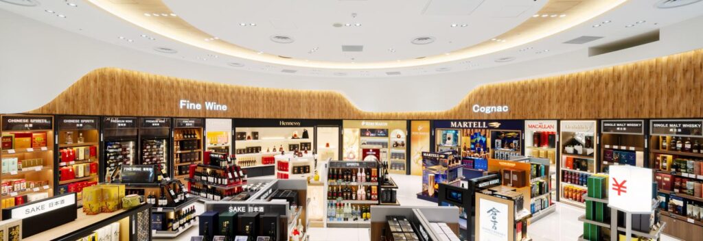 A duty free store at an airport. There's a plethora of alcohol on the shelves