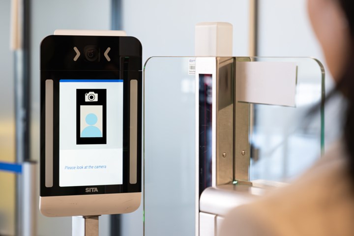 A checkpoint terminal requesting the user to look into the camera for a photograph
