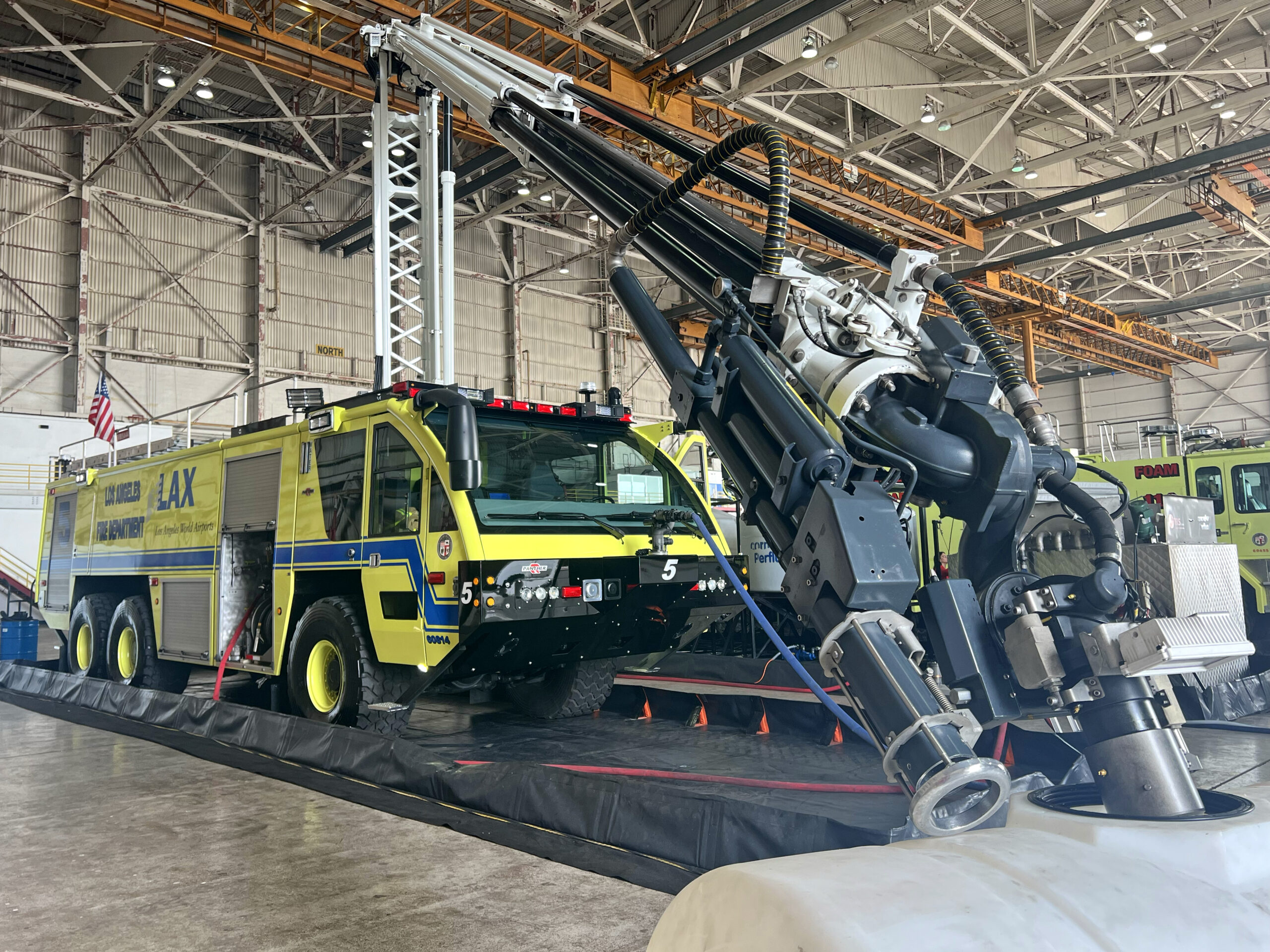 An aircraft rescue firefighting response (ARFF) truck completes rinsing and transition from Aqueous Film Forming Foam (AFFF) to Fluorine-Free Foam (F3) at Los Angeles International Airport