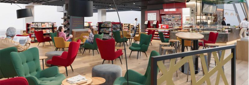 An airport lounge with red and green armchairs