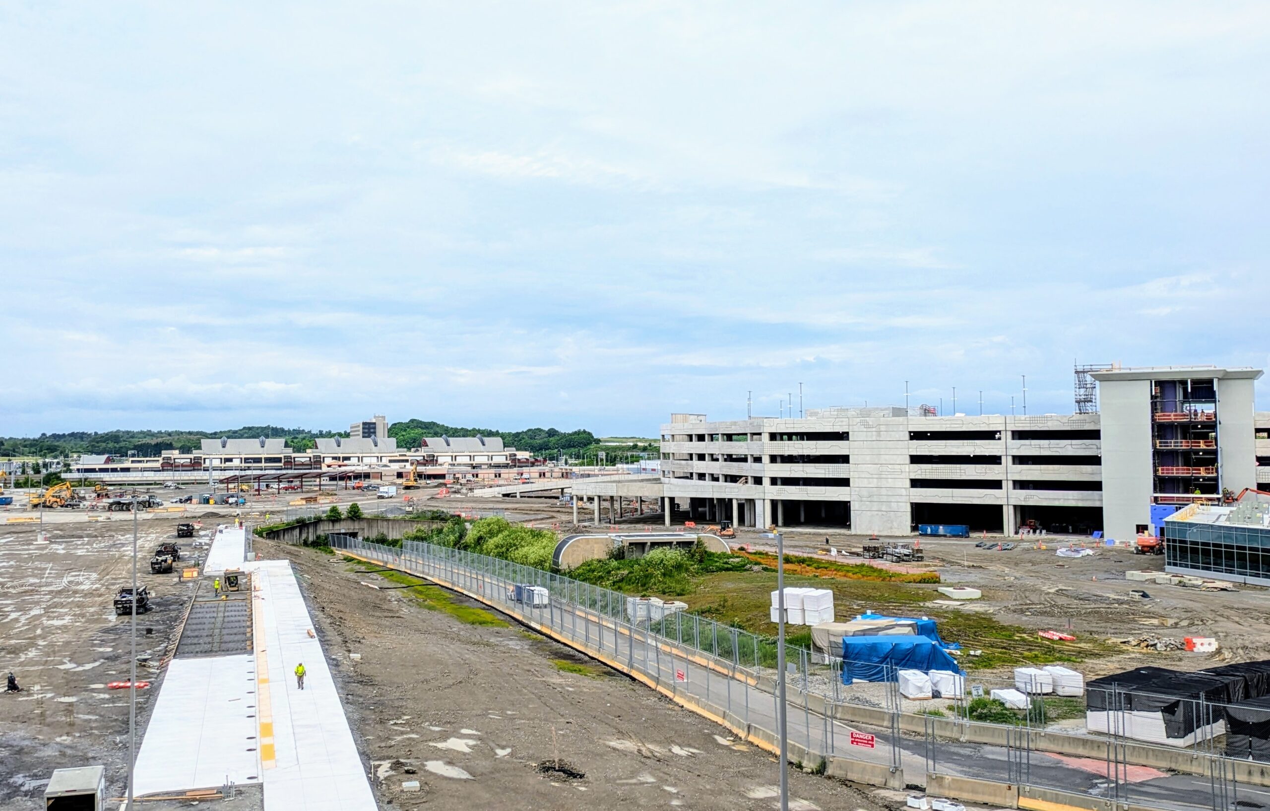 A baggage tug travels from airside to landside at PIT