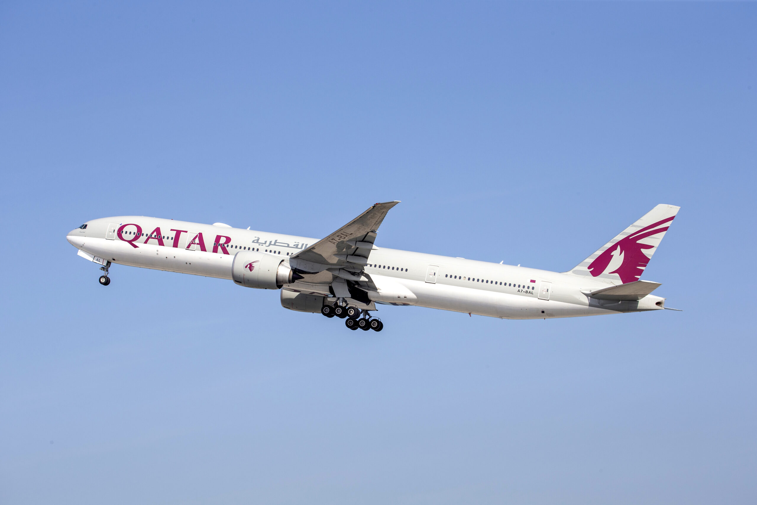 A Qatar Airways branded plane in flight