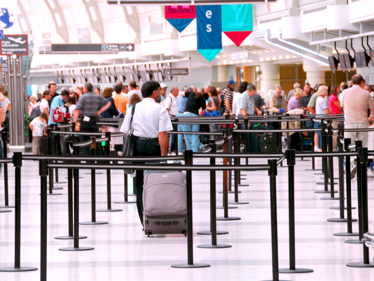 Passengers queueing at an airport