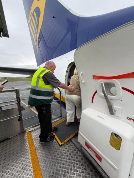 Passenger using a Portaramp to board the aircraft.
