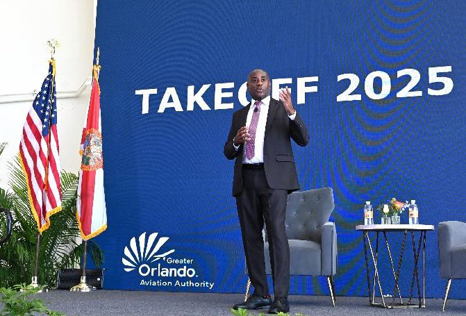 A man standing and giving a speech