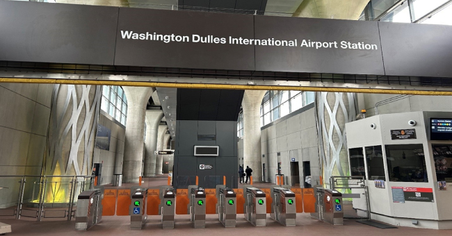 A sign welcoming travellers to Dulles International Airport
