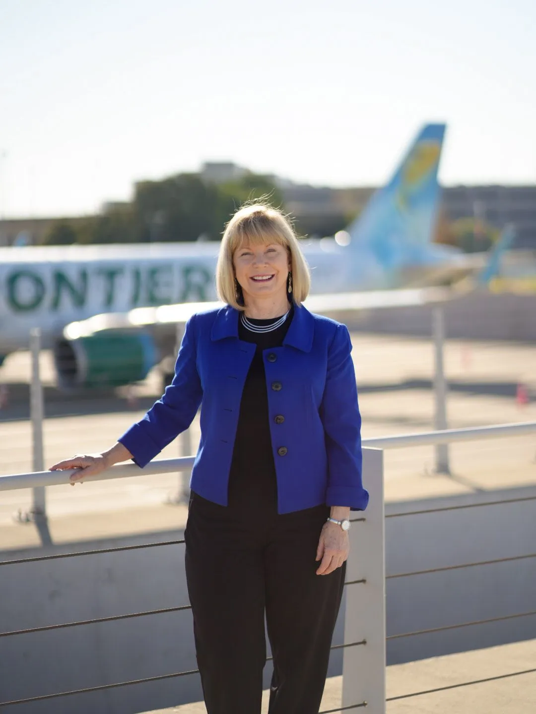 Cindy Nichol in front of a plane