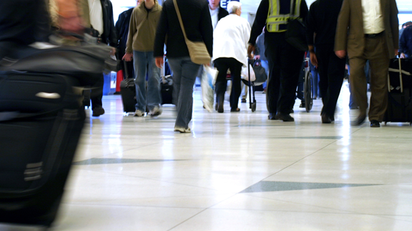 People walking through an airport