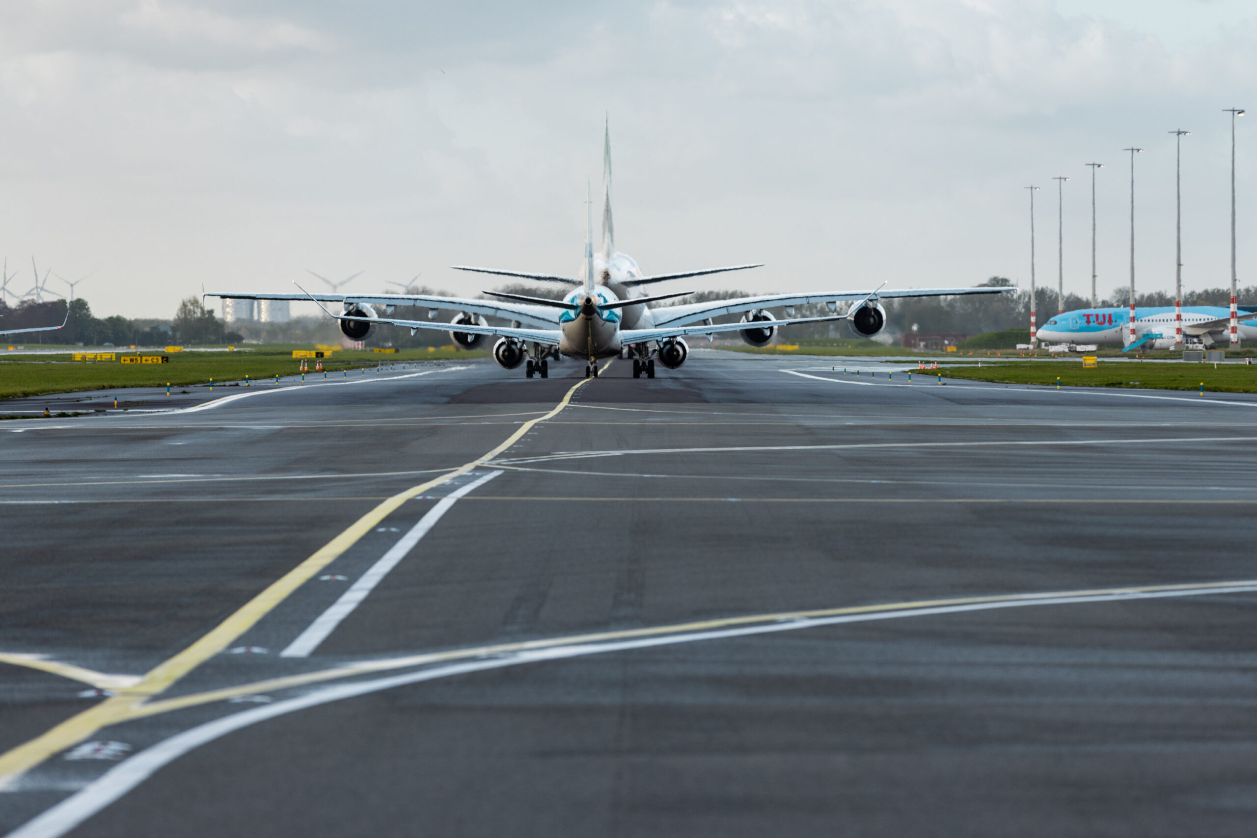 A plane taxiing on a runway
