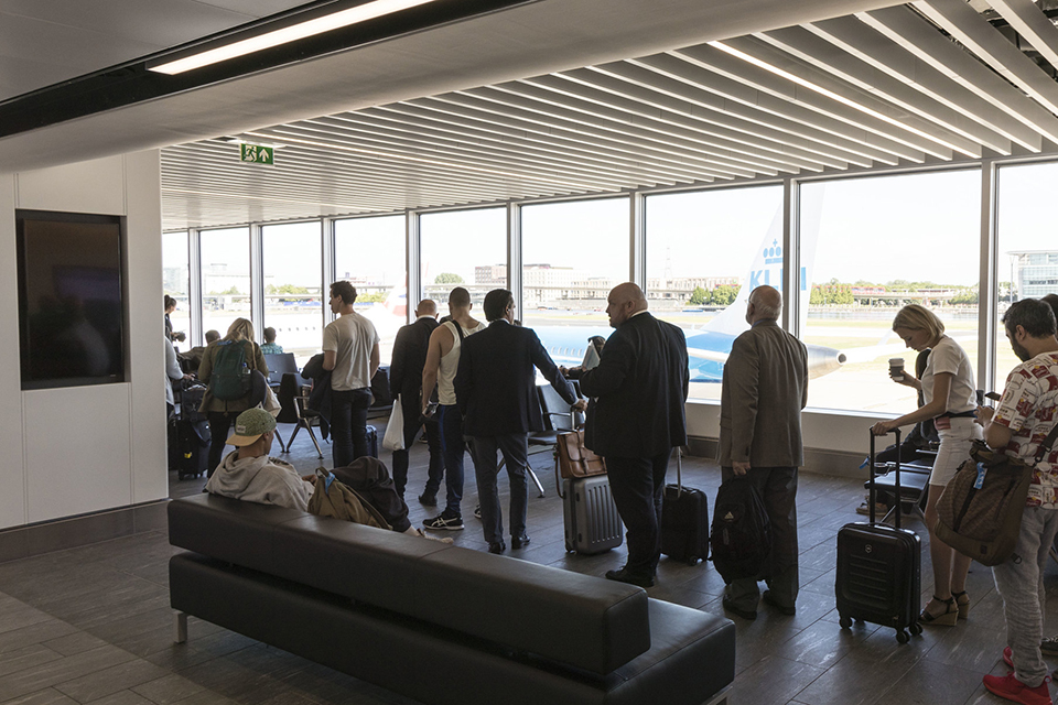 People queuing at an airport gate
