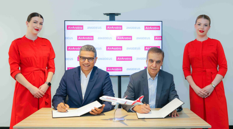 Adel Al Ali, Group Chief Executive Officer of Air Arabia, and Maher Koubaa, Executive Vice President Travel Unit and Managing Director EMEA at Amadeus, sign a distribution agreement that extends Air Arabia's reach across Amadeus' global travel seller network.