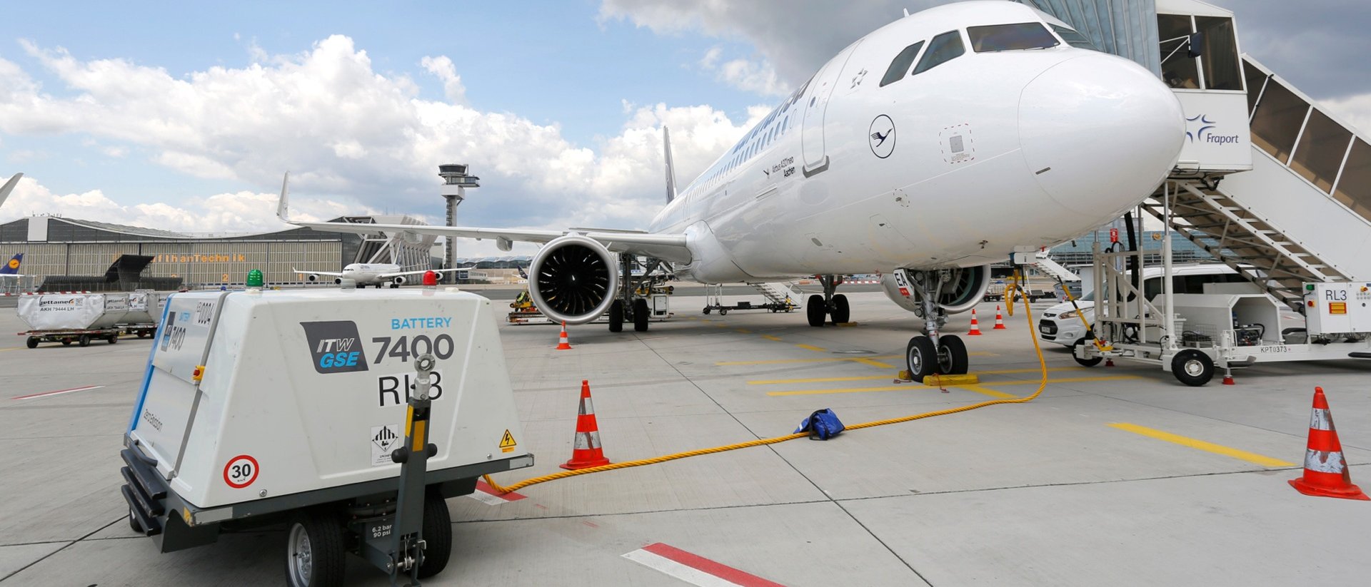 A plane and a tugger